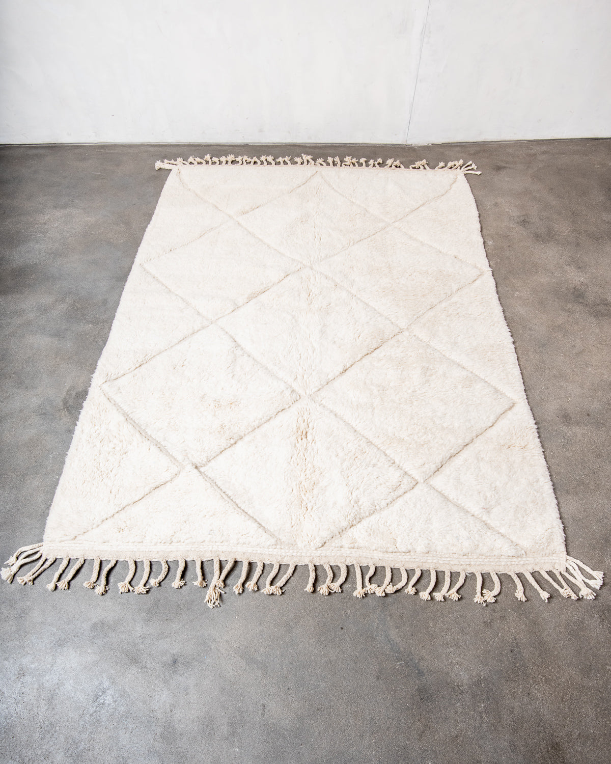 Modern, designer, handcrafted Berber rug from Morocco. Beniourain carpet with minimalist design, natural wool pile and a fluffy texture.